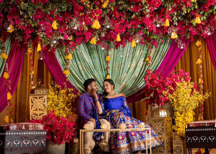 Couple on decorated stage at the Sangeet ceremony