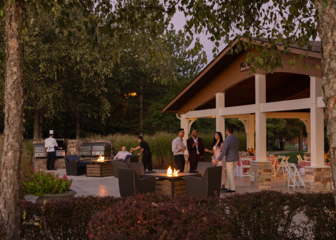 A group using lansdowne resort's hotel meeting offers, dining outdoors in Lansdowne's pavilion.